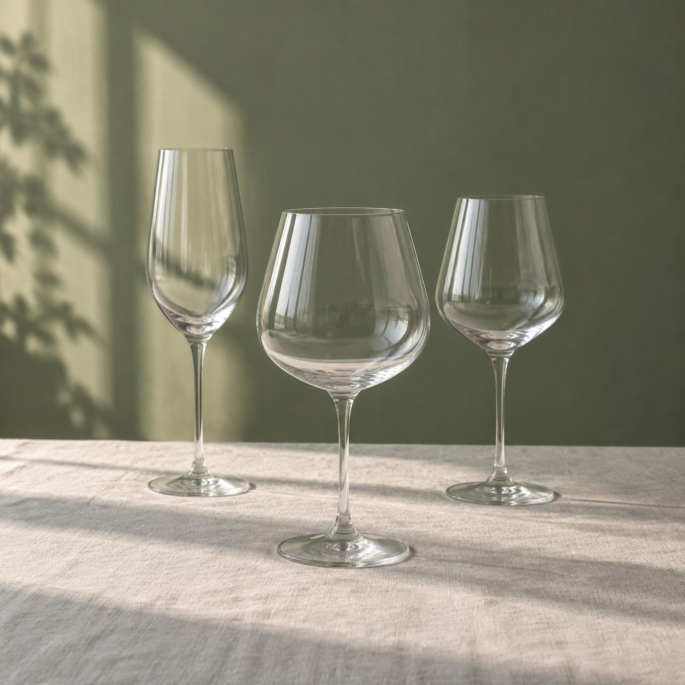 Wine glasses catching soft natural light